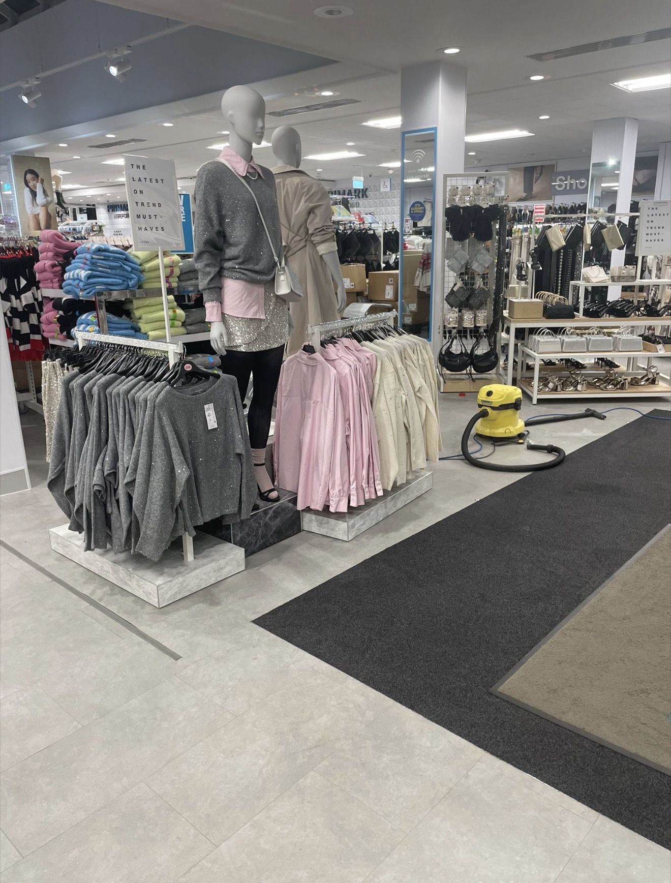 Retail environment prepared for cleaning around fixtures and displays